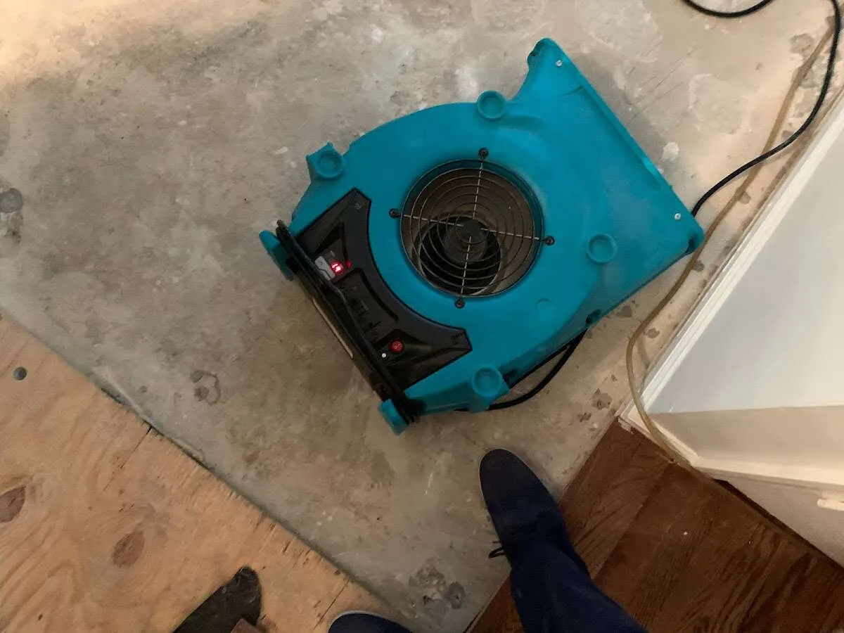 Air mover drying subfloor during Leak Detection & Repair in Silver Lakes